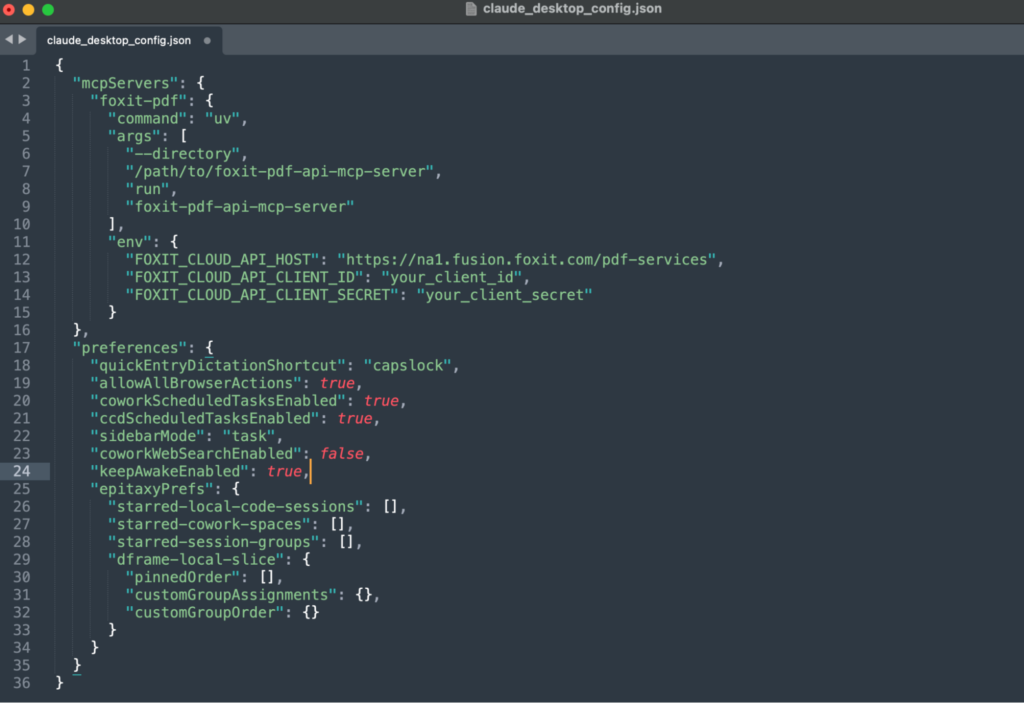 The claude_desktop_config.json file open in a text editor, showing the foxit-pdf server registered under mcpServers with its command, args, and env credentials.